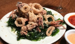 Fried Calamari with flash fried spinach